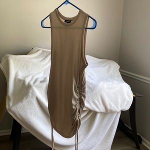 Express sleeveless tan blouse with gather sides been worn once